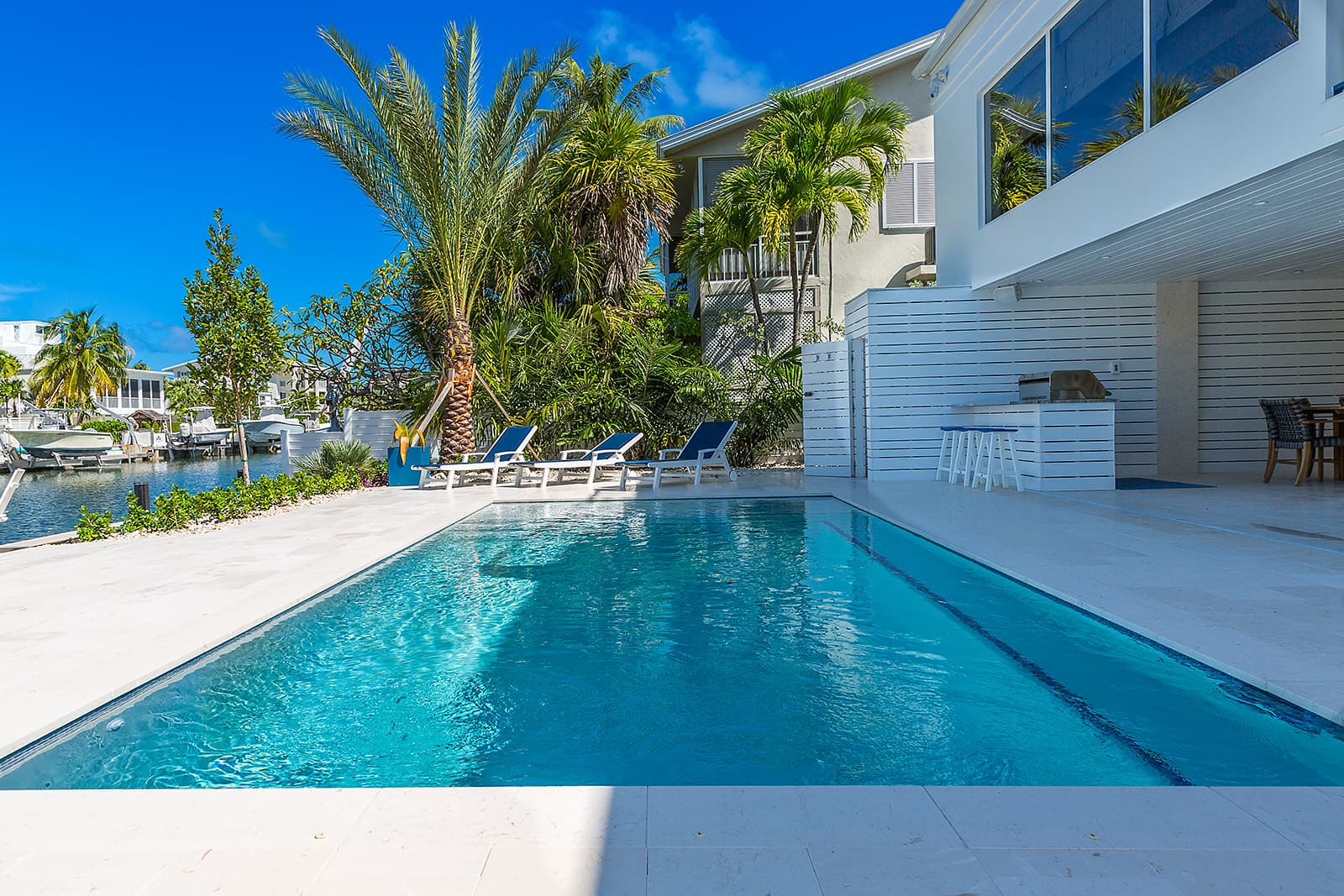 Outdoor kitchen, dock, and canal