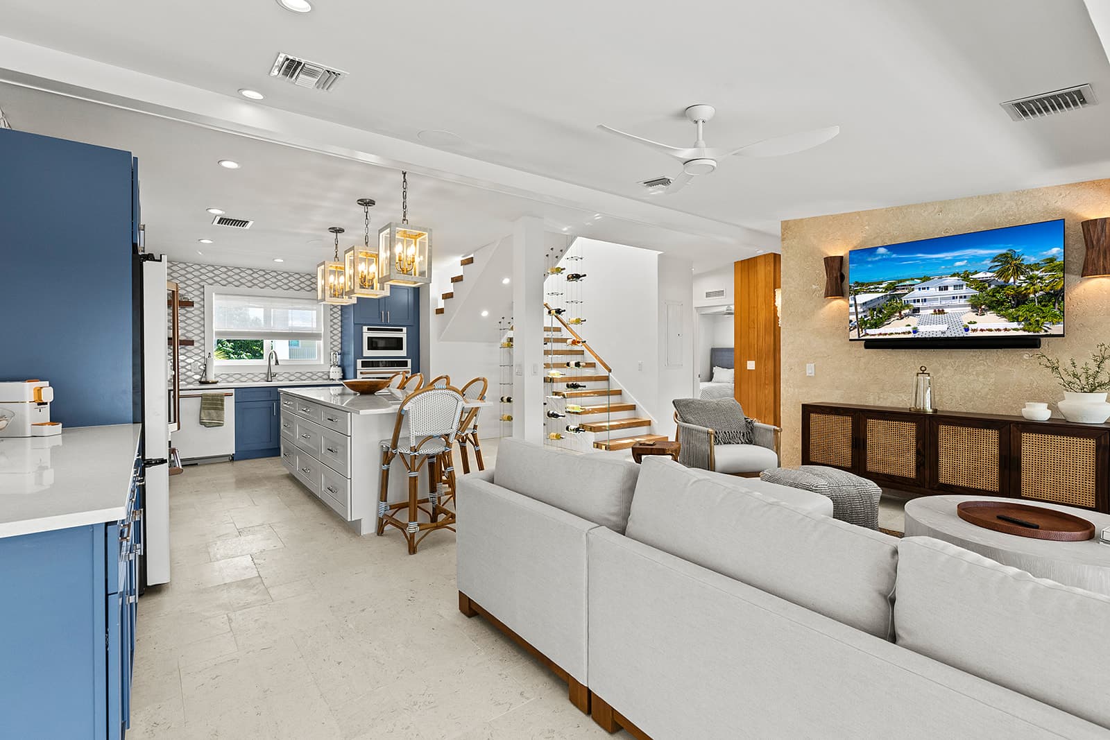 Kitchen and living room with blue cabinetry